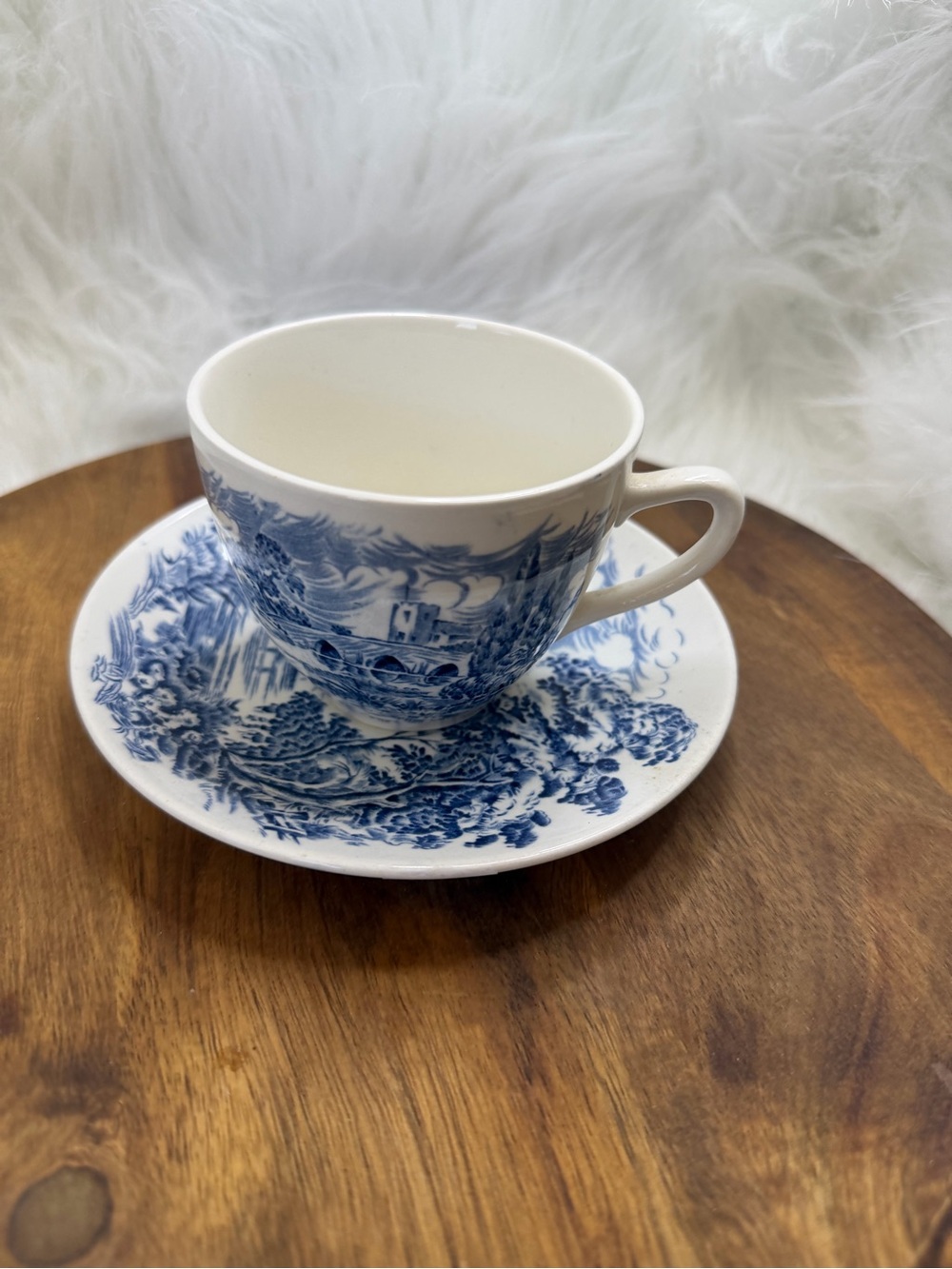 Enoch Wedgwood "Countryside" pattern blue and white teacup and saucer.